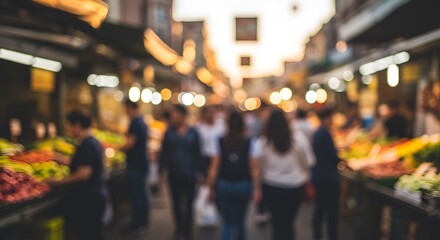 Fototapeta premium Blurred market scene with shoppers and stalls, perfect for retail or shopping content.