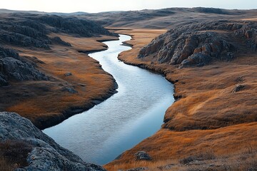 A winding river flows gently through a rugged canyon, embodying the continuous flow of thoughts