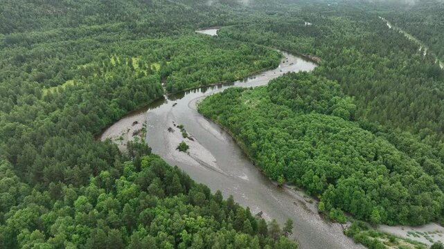 Aerial view of Alta river winding through lush green surroundings in Norway