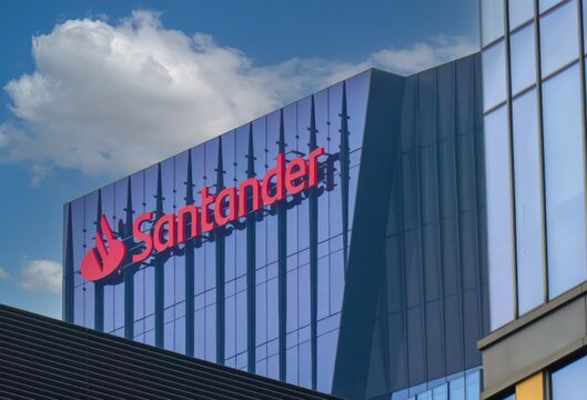 Santander Bank logo on the facade of the office building.