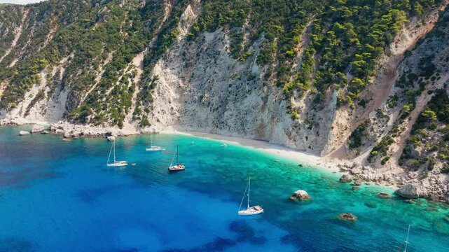 Slow panning drone shot paradise beach of Platinamos in Ithaca, the ionian island of Greece