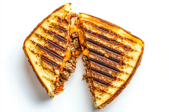 a grilled sandwich cut in half on a white surface