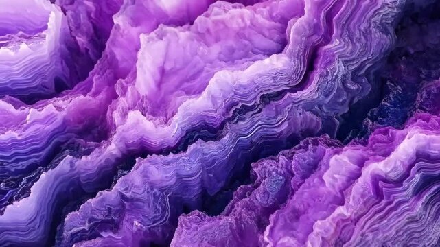 A close-up view of purple Sugilite agate stone with intricate layers and patterns, showcasing various shades of purple and white. The texture is smooth and glossy, highlighting the natural beauty.