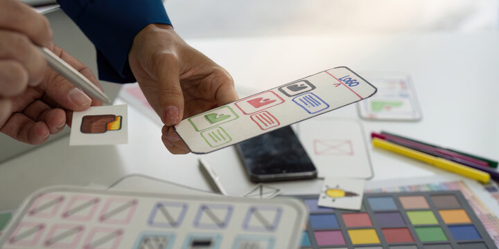 Interactive Design Review Session. Participants analyzing features and components of a digital application.