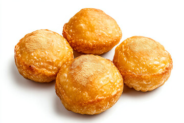 Fototapeta premium a group of four pastries sitting on top of a white surface