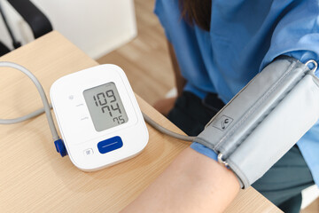 Physical therapy, person is undergoing physical therapy while monitoring their blood pressure with...