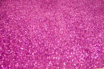 A soft pink bokeh-style background with unfocused light creates an elegant space for text or design elements.