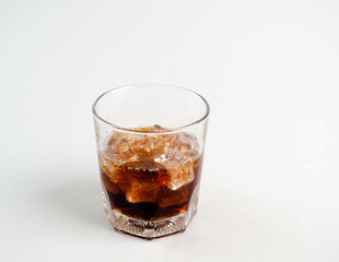 Cola with Ice Cubes on a White Background | Refreshing Cola Drink.