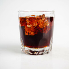 Cola with Ice Cubes on a White Background | Refreshing Cola Drink.