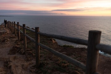 Obraz premium Viewpoint at Cabo Roca. Western cape of mainland Portugal. Sunset and the Atlantic Ocean. Suitable for wallpaper or screensavers
