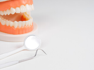 Dental tools for examination. Probes, mirrors, picks; close-up on instruments used for oral health diagnosis.