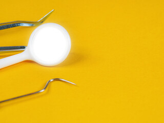 Dental tools for examination. Probes, mirrors, picks; close-up on instruments used for oral health diagnosis.