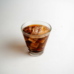 Cola with Ice Cubes on a White Background | Refreshing Cola Drink.