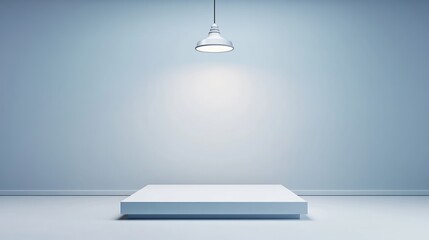 Spotlight shines onto a white platform in a blue room
