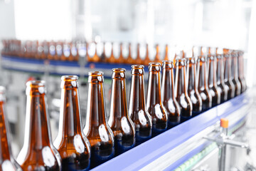 Automated beer bottling line in modern brewery factory setting