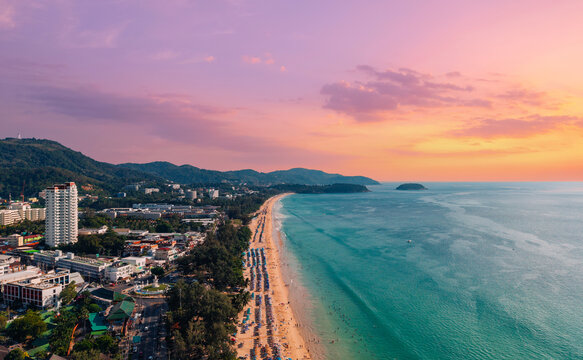 Sunset at karon beach on Phuket island Thailand with vibrant sky and scenic coastline
