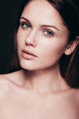 Obraz premium Fashion beauty portrait of young brunette woman with natural makeup and perfect clean skin. Pure model with posing in studio