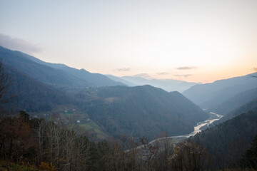 Obraz premium Beautiful sunny landscape of mountains, river and trees in Variaki, Georgia