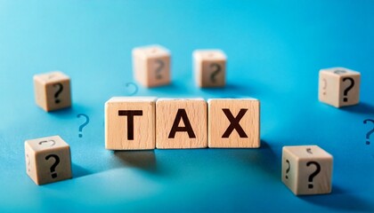 TAX  Day  Wooden letter blocks spelling TAX, blue background, fists raised in protest, financial concept, income tax, taxation frustration, minimalist composition, shallow depth of field, macro 