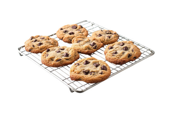 Freshly baked chocolate chip cookies cooling on a wire rack in a bright kitchen setting isolated on transparent background - Powered by Adobe