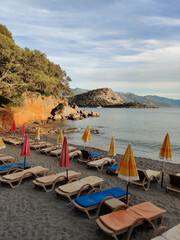 deck chairs and umbrellas on the sea beach in summer