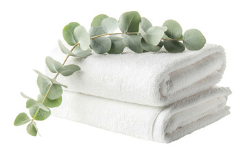 Fresh eucalyptus sprig resting on neatly stacked white towels for a tranquil setting isolated on transparent background