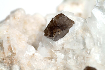 Mineral Scheelite, brown octahedral crystals on white calcite that covers solid arsenopyrite, Hunan Province, China