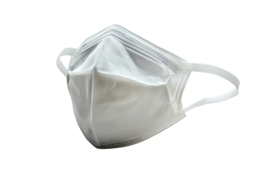 A close-up view of a surgical mask resting on a smooth surface in a well-lit setting isolated on transparent background