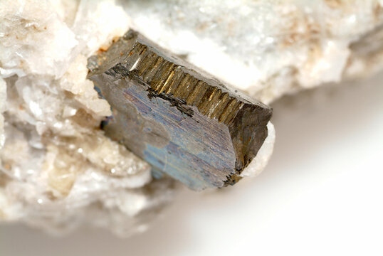 Mineral Scheelite, brown octahedral crystals on white calcite that covers solid arsenopyrite, Hunan Province, China