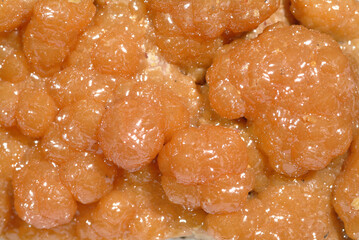 Mineral Mimetite, Varient Campylite, Lusterous orange mimetite crystal covering surface of 'egg shell' matrix, Bunker Hill mine, Kellogg, Shoshone Co., Idaho, USA