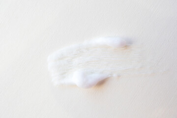 Smear of foam bubbles on a light background