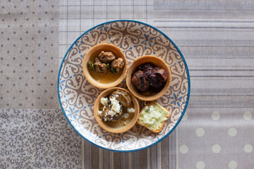 a delicious dish of cooked snails on a plate