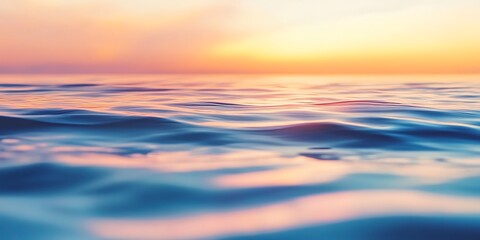 Obraz premium a close up of water with the sun setting behind it