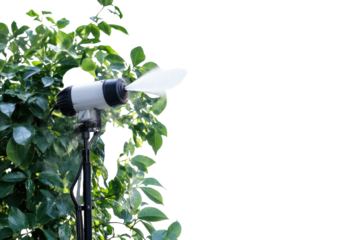 Misting device refreshing a lush garden on a warm sunny day amidst vibrant green foliage isolated on transparent background