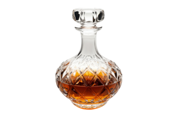 Amber liquid in a crystal decanter glistens on a white surface isolated on transparent background