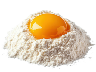 egg yolk on flour pile, isolated on white background