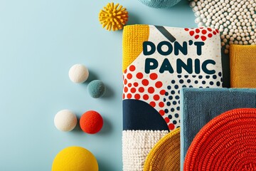 Colorful geometric pattern with inspirational message on textured fabric and decorative balls