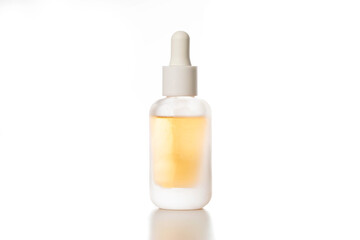 Yellow bottle with oil for hair ends on white background, isolate, close-up