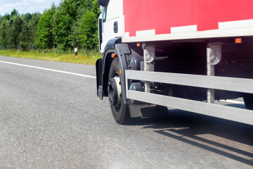 Specialized trucks with a carrying capacity of up to 5 tons transport cargo along the highway in...