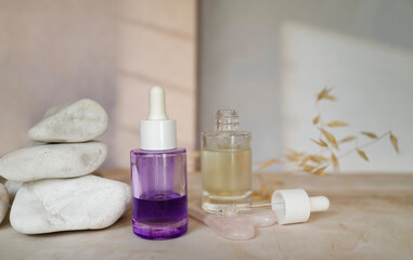 Bakuchiol face serum in a glass bottle on shadows background 