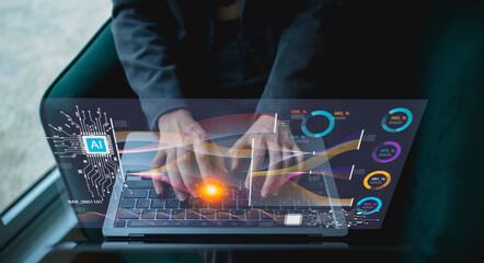A person types on a laptop with futuristic holographic data visualization showcasing AI analytics and metrics.