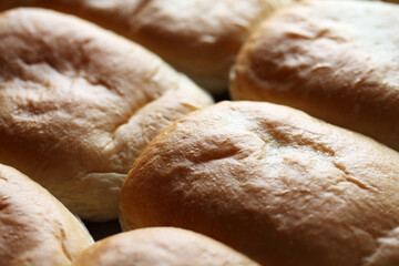 Freshly Baked Soft Bread Rolls on a Wooden Surface Close Up