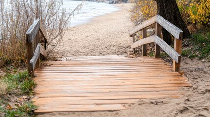 Wooden stairs on boardwalk descending to beach.