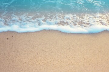 Soft blue ocean wave on sandy beach. Background.