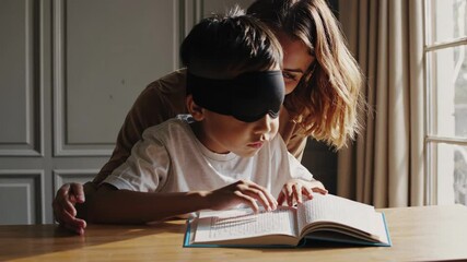 Young boy learning braille with teacher's help - Powered by Adobe