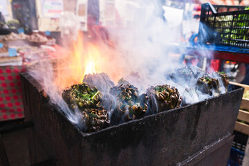 Grilled Sicilian artichokes at the food market in Catania Italy