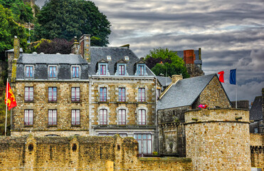 A View of Mont Saint Michel with French Flag Waving Proudly, Normandy, France