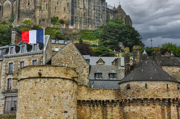 A View of Mont Saint Michel with French Flag Waving Proudly, Normandy, France