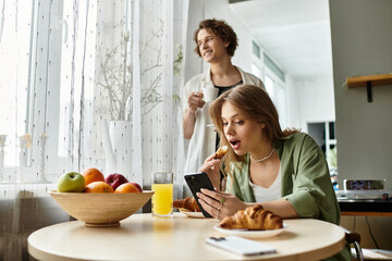 Loving couple enjoying a cozy morning with breakfast and moments of shared laughter at home