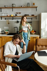 Young couple enjoys cozy moments together while working and relaxing at home on a sunny afternoon